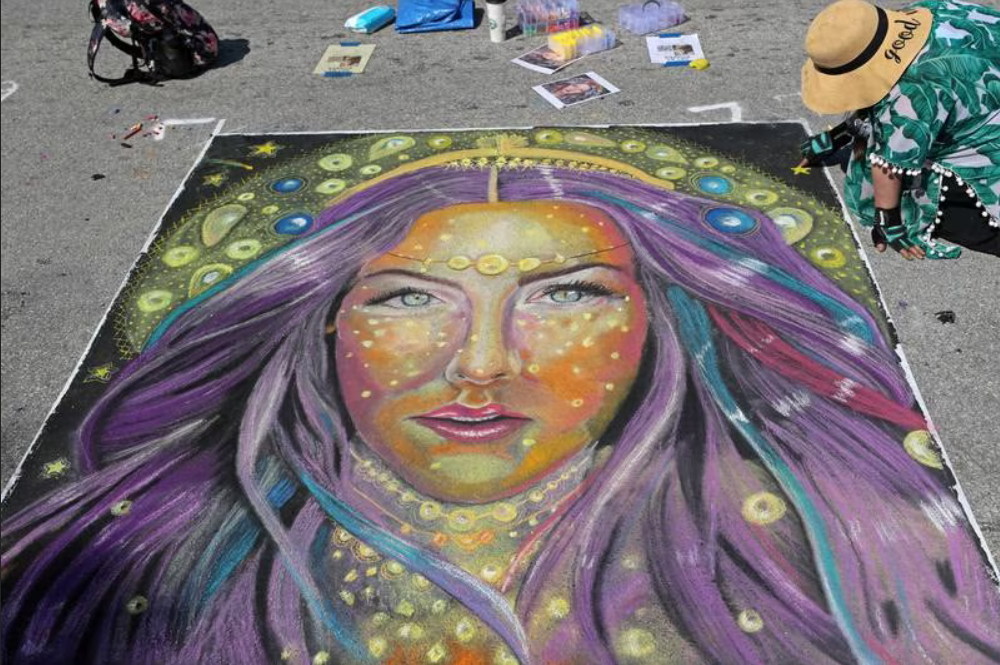 chalk art drawing of a woman with stars